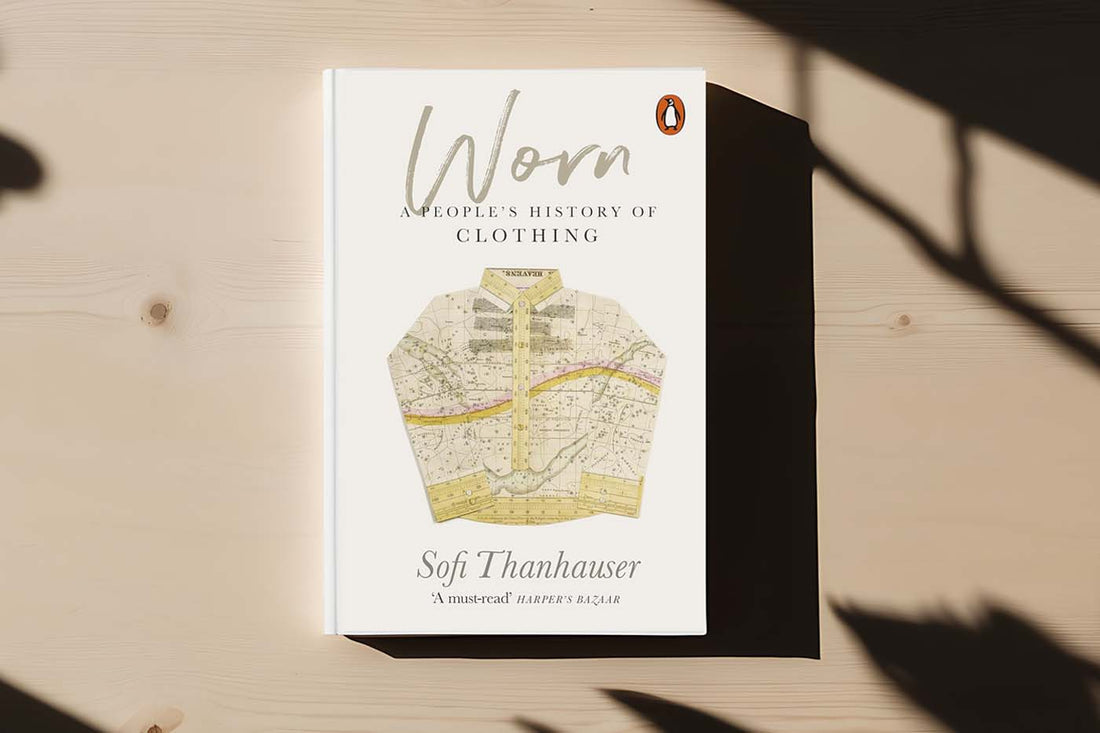 Cover of Worn: A People’s History of Clothing by Sofi Thanhauser, exploring textiles, fashion sustainability and regenerative fashion.